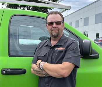 male, goateau, posing in black servpro shirt