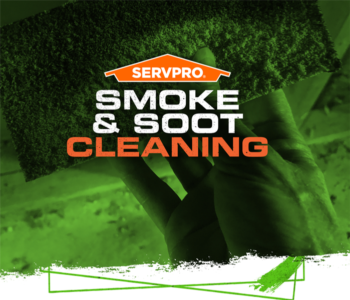 SERVPRO technician holding cleaning tools with the caption: SMOKE & SOOT CLEANING